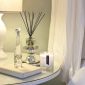 PAIRFUM luxury scented candle, natural reed diffuser and couture perfume room spray on the bedside table in a French chatteau