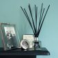 PAIRFUM luxury and natural reed diffuser on a fire surround in an art deco house