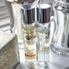 pairfum petite perfume room spray on window sill in modern livingroom with chrome decor
