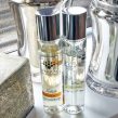 pairfum petite perfume room spray on window sill in modern livingroom with chrome decor