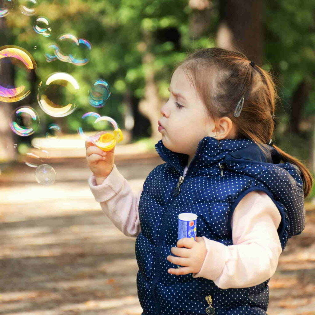 Kates Garden Child Blowing Bubbles