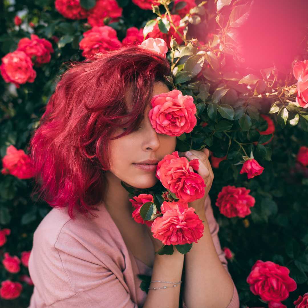 fragrance layering; a woman holding flowers