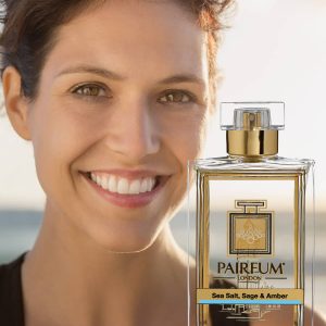 Eau De Parfum Person Reflection Sea Salt Sage Amber Woman Smiling 9 16 Eau De Parfum Person Reflection Sea Salt Sage Amber Woman Smiling 9 16