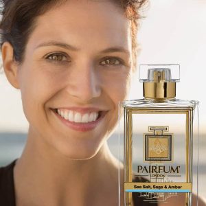Eau De Parfum Person Reflection Sea Salt Sage Amber Woman Smiling 9 16 Eau De Parfum Person Reflection Sea Salt Sage Amber Woman Smiling 9 16
